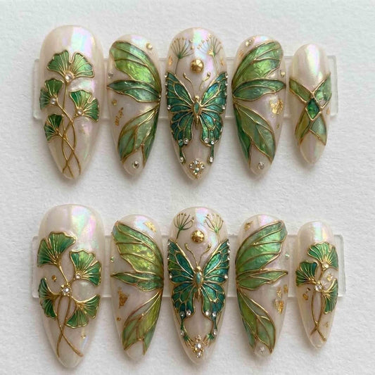 Close-up of 3D butterfly nail art with delicate gold filigree detailing on premium hand-painted gel fake nails, perfect for a fairycore-inspired manicure.