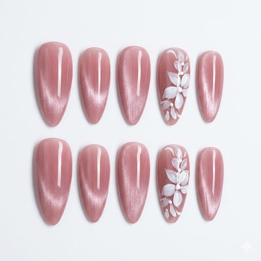 Close-up of intricate hand-painted floral motifs on premium cat-eye gel tips, showcasing the high-gloss finish and artistic detail of JRNAIL handmade nails.