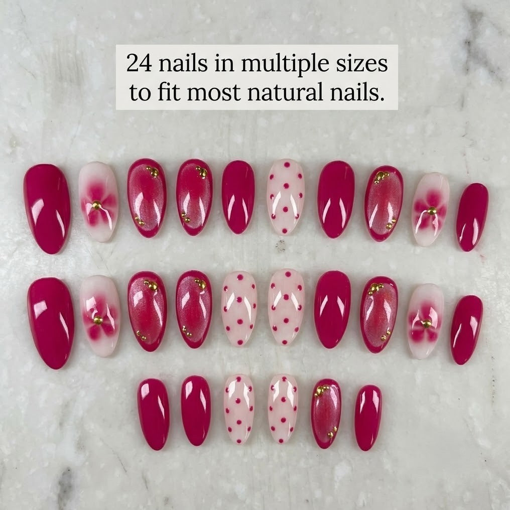 Assorted pink and red nail extensions on a marble surface with text indicating size compatibility.