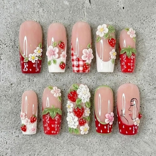 Close-up of 3D strawberry charm and floral design press-on nails by JRNAIL.