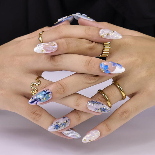 Luxury mixed almond press-on nail set with watercolor blue floral art and gold outline detail