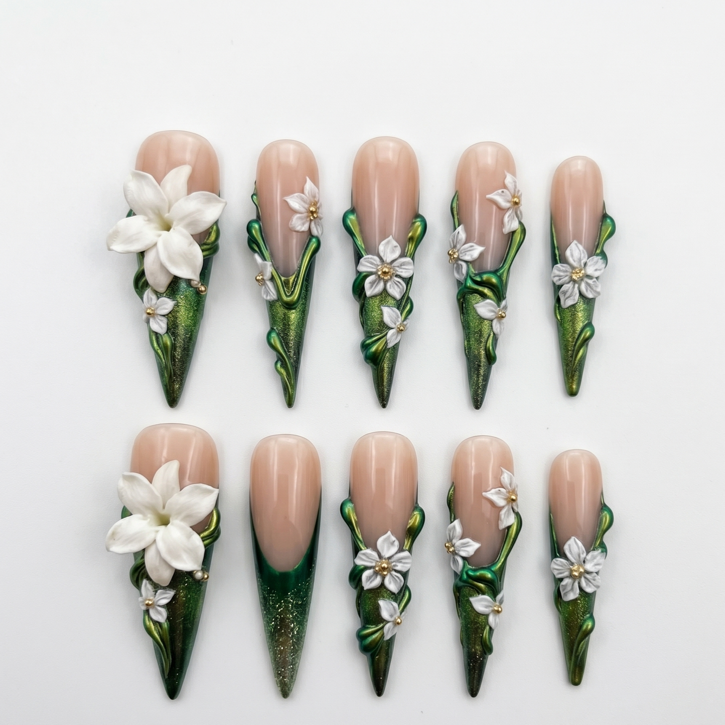 Premium stiletto-shaped press-on nails featuring high-relief 3D botanical art and metallic ivy green finishes, perfect for a statement manicure.