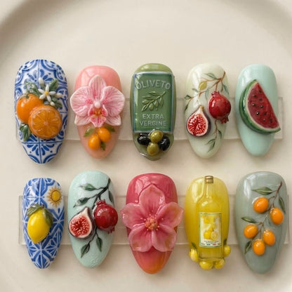 Custom 3D gel press-on nails with hyper-realistic summer fruits including watermelon, fig, pomegranate, and olive branch artwork.
