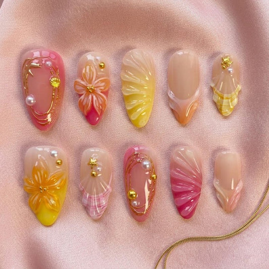 Beach themed almond nails with starfish, floral art, and glossy finish