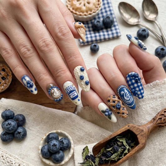 Handmade 3D gel press-on nails featuring blueberry pie, jam, and swan latte art.