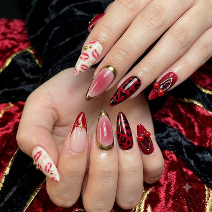 Long almond cherry red press on nails featuring 3D cherry charms, leopard print, glossy French tips, kiss print nail art, and luxury reusable fake nails by JRNAIL.