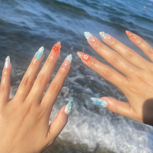 Tropical beach fake nails with 3D seashells, jellyfish designs, and hand-painted hibiscus flowers