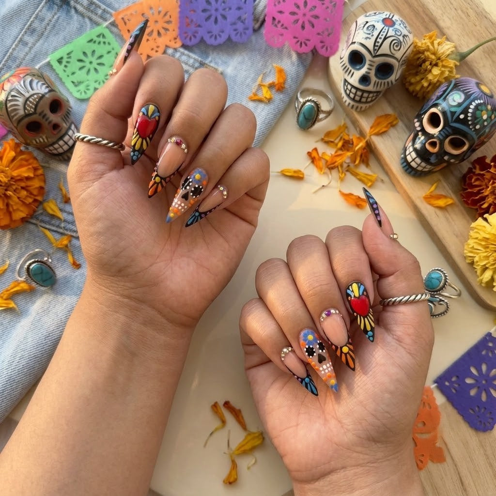 JRNAIL high-fashion stiletto fake nails showcasing a high-shine gel finish with vibrant Mexican folk-art sugar skull accents, perfect for an expressive DIY home manicure.
