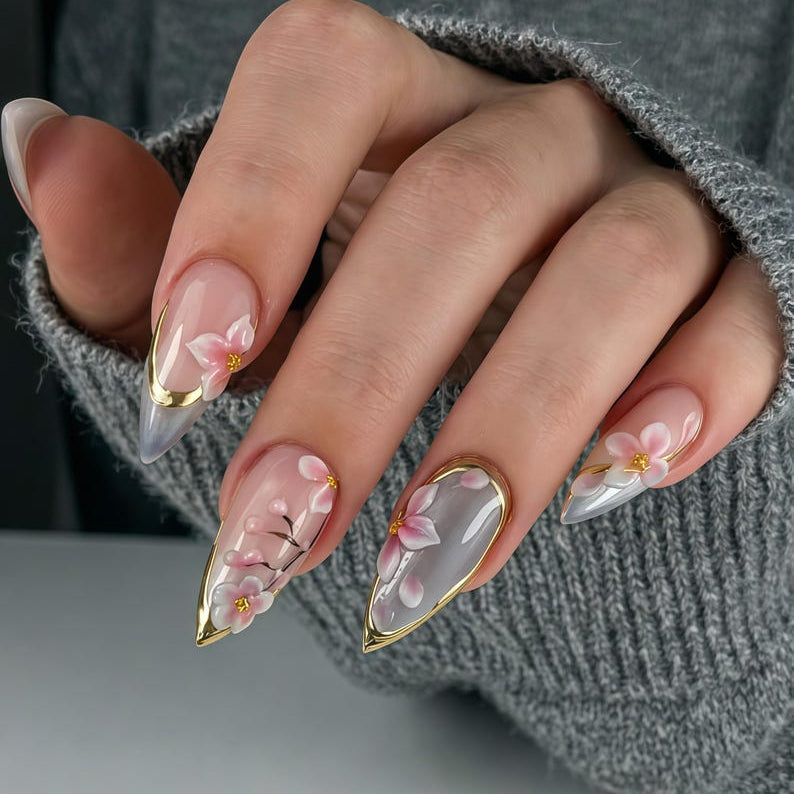 An elegant floral aesthetic gel manicure featuring pink cherry blossoms, perfect for weddings, romantic dates, or a fresh spring-inspired look.