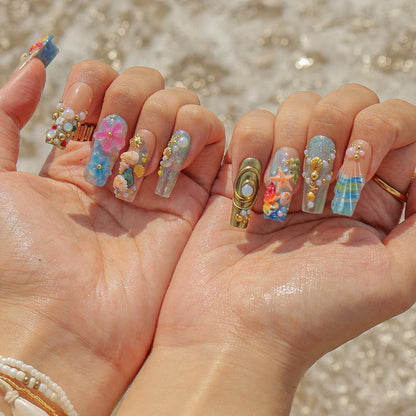 Reusable mermaid press on nails with 3D seashells, starfish, and iridescent glitter finish for summer festivals