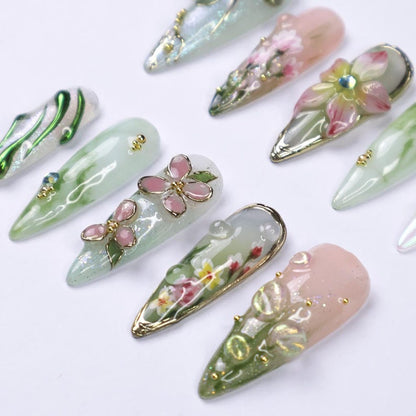 Glossy ethereal press on nails with 3D dragonfly, floral, and marble designs, gold accents, and crystals for spring