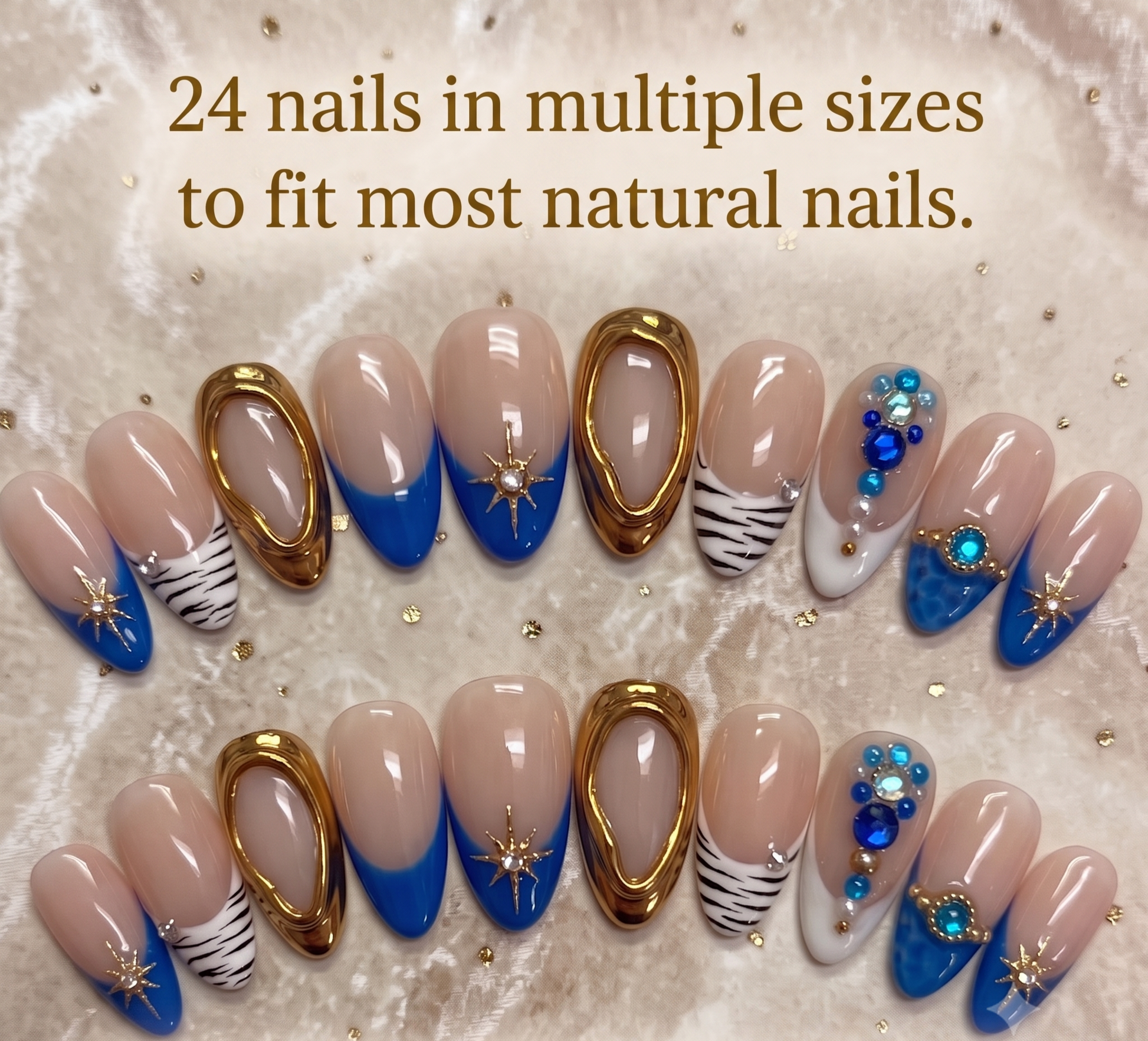 A full 24-piece luxury press-on nail set featuring royal blue French tips, hand-painted zebra stripes, and 3D molten gold textures with star charms laid out on a soft fabric background with text reading '24 nails in multiple sizes to fit most natural nails.
