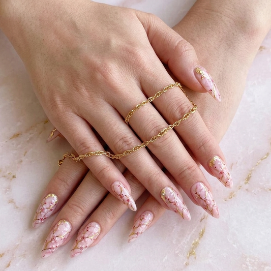 Luxury handmade cherry blossom stiletto press-on nails with pink marble and gold foil accents by JRNAIL.