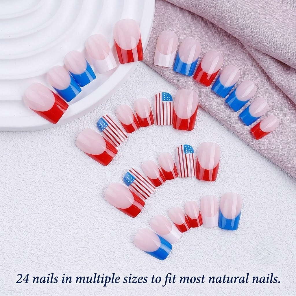 A top-down product display showing 24 pieces of red, white, and blue press-on nails in various sizes arranged beautifully on a textured white background with subtle fabric accents, featuring the English text '24 nails in multiple sizes to fit most natural nails.' at the bottom.