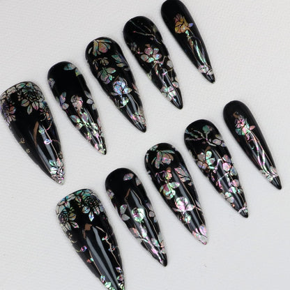 Long black stiletto fake nails with holographic pink silver green floral foil detail