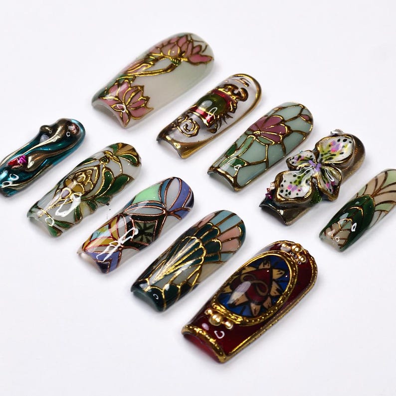 3D gemstone stained glass press on nails, red and green jewel accent design, gold metallic line art luxury false nails for formal events