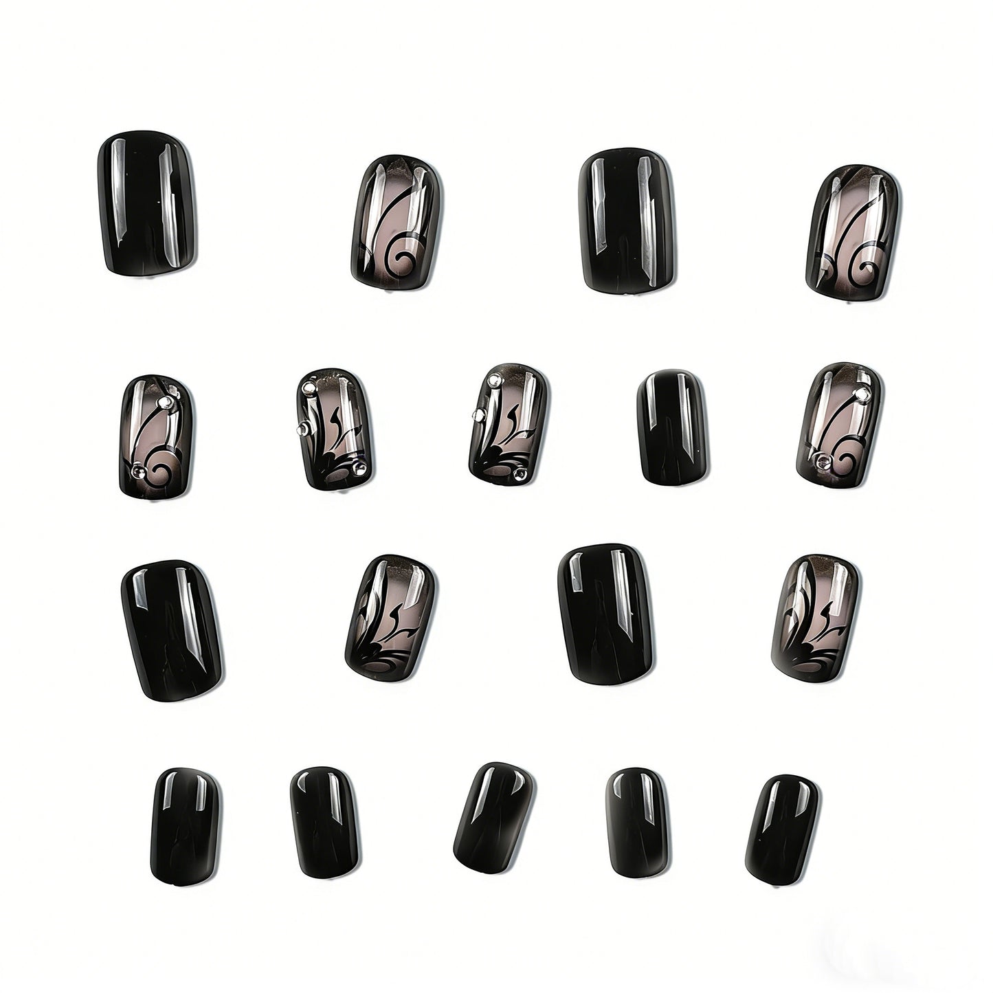 Close-up of hand wearing JRNAILS black and nude press on nails with intricate butterfly art and crystal embellishments