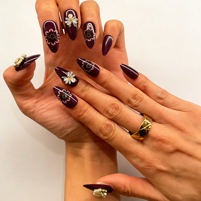 Deep purple false nails with celestial moon star and floral mandala details for elegant occasions