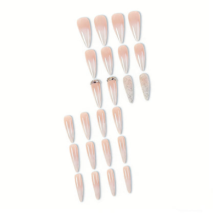 Soft nude ombre almond press on nails with silver glitter and rhinestone decorations, non-toxic reusable false nails for easy salon-worthy manicure at home