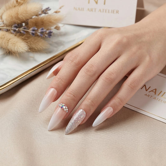Elegant nude gradient press on nails featuring sparkling silver glitter accents and crystal rhinestones, reusable almond-shaped fake nails for everyday glamour