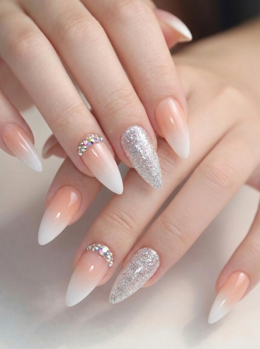 Nude ombre almond press on nails with silver glitter and AB rhinestone clusters, reusable salon-quality false nail extensions for at-home manicure