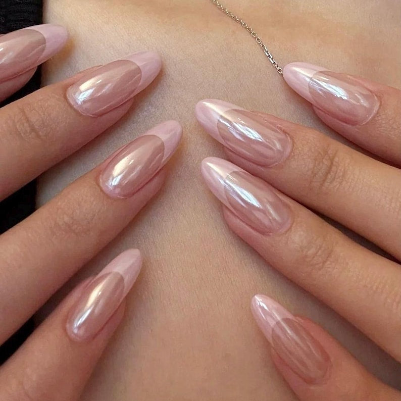 A modern and minimalist chrome French manicure, perfect for those who love the "clean girl" aesthetic and high-gloss, reflective nail designs.