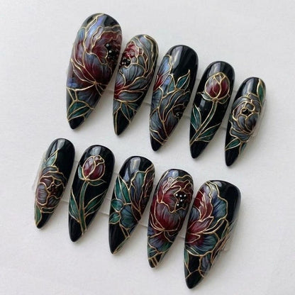 Moody dark floral gel nails with a cathedral-inspired stained glass effect, perfect for those seeking a bold, artistic, and statement-making manicure.