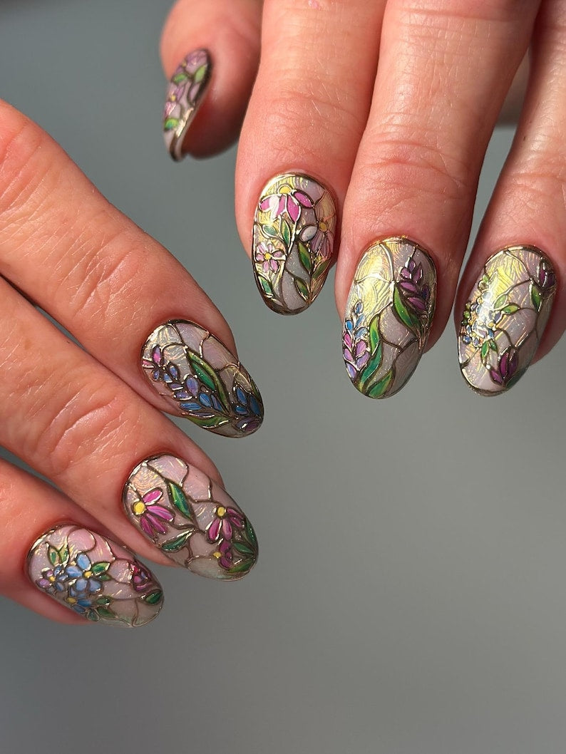 Durable and reusable press-on nails showcasing beautiful stained glass-style botanical art, perfect for a high-end salon-quality look.