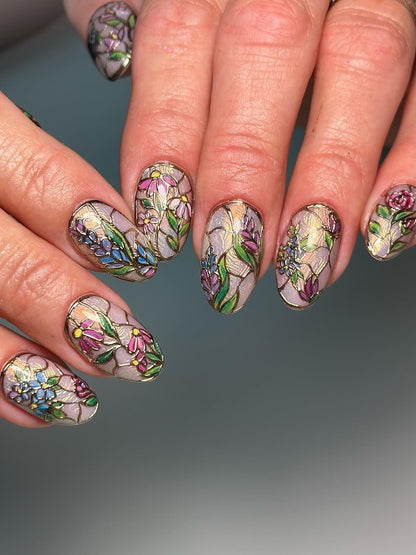Vintage European-inspired floral press-on nails with detailed gold filigree, designed for an elegant and high-fashion aesthetic.