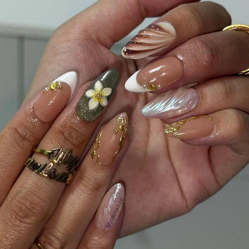 Luxury kintsugi almond press on nails with plumeria flowers, nude French tips, and sage green base