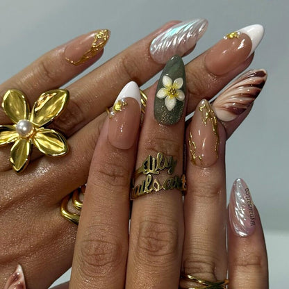 Vintage sage green plumeria press on nails with gold kintsugi line art and iridescent shell swirls
