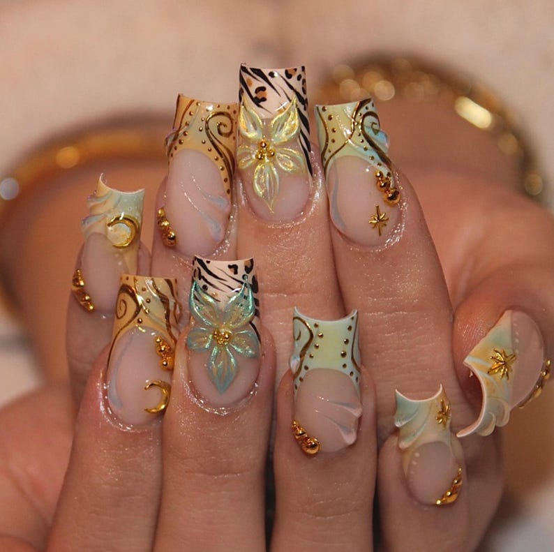Long coffin press-on nails with 3D iridescent flower and gold moon charm on nude base