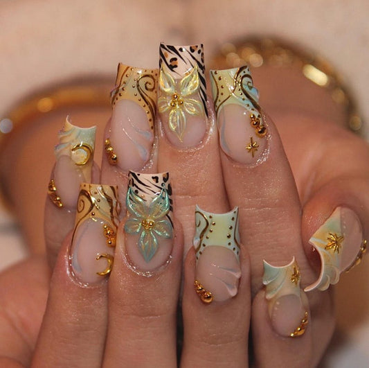 Long coffin press-on nails with 3D iridescent flower and gold moon charm on nude base