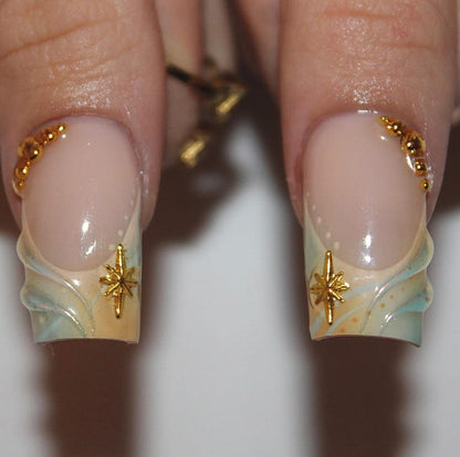 Set of 10 handcrafted coffin press-on nails with iridescent 3D flowers and gold celestial charms