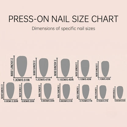 A clear JRNAIL product infographic titled 'PRESS-ON NAIL SIZE CHART' in English, showing 12 different almond nail silhouettes. Each piece includes precise width and length measurements labeled in both centimeters and inches, ranging from a 1.3cm thumb size down to a 0.65cm pinky size on a soft pink gradient background.