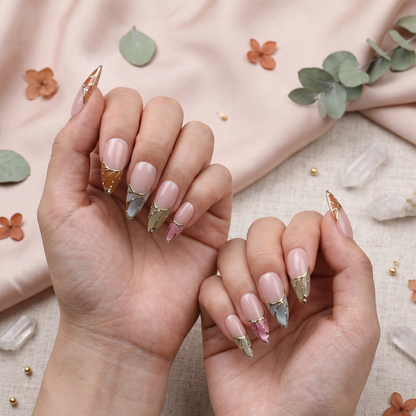 A complete set of 10 handcrafted butterfly wing press-on nails displayed on a clean white background, showcasing colorful wing tips with gold lining on a nude base.