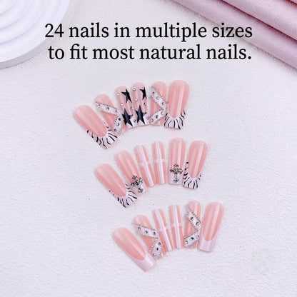 24 pieces of JRNAIL long coffin reusable artificial nails lined up symmetrically, displaying intricate 3D silver cross charms, star designs, and trendy abstract line art.