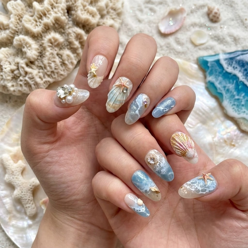 Handmade-style 3D ocean wave and seashell press-on nails displayed flatlay, including multiple nail sizes and nail application kit.
