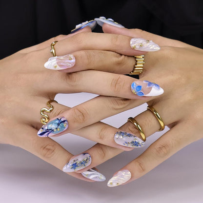 Luxury mixed almond press-on nail set with watercolor blue floral art and gold outline detail