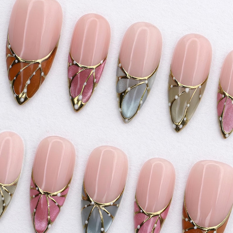 Luxury nude French tip press-on nails by JRNAIL, featuring a semi-translucent base and colorful butterfly wing details.