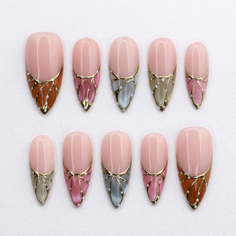 Multicolor stiletto fake nails with intricate hand-painted butterfly wing patterns in orange, pink, grey, and green.