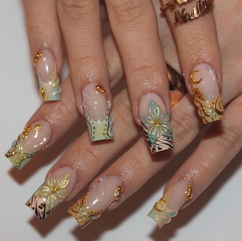 Mixed nail art coffin press-on nails with leopard print, gold star charms and holographic flower detail