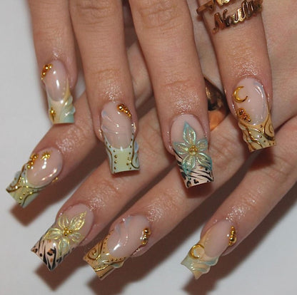 Mixed nail art coffin press-on nails with leopard print, gold star charms and holographic flower detail