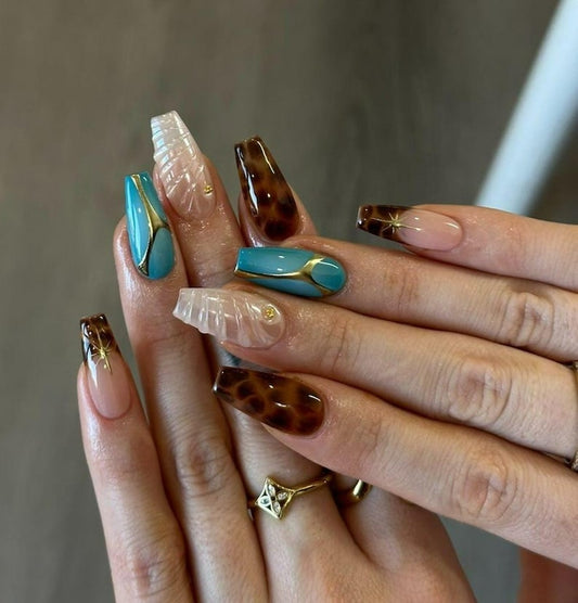 Long coffin press-on nails set with tortoiseshell, pearl swirl, turquoise gold line and blush pink designs